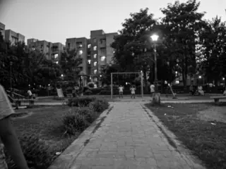 ahead: the park path, children on the swings
